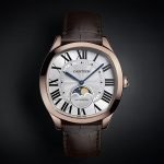 Cartier wristwatch with moon-phase display and brown leather strap